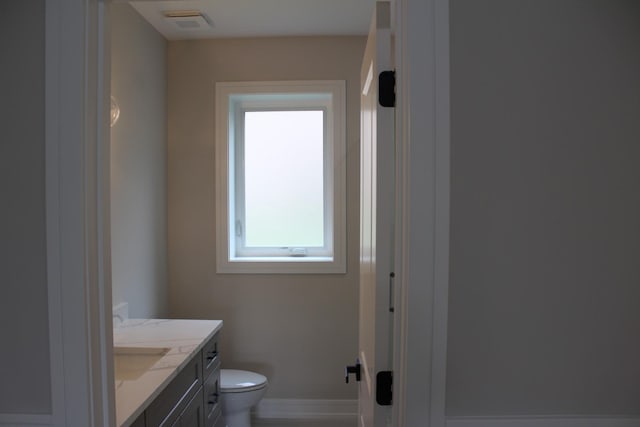 5660 W 83rd Pl, Burbank, IL 60459 - bathroom with vanity, toilet, and baseboards