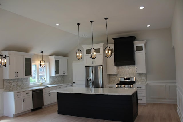 5660 W 83rd Pl, Burbank, IL 60459 - kitchen featuring stainless steel appliances, a chandelier, a center island, light wood-style floors, and a sink