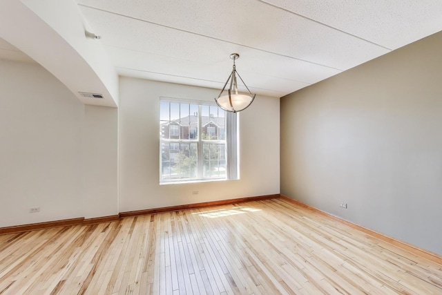 16671 Liberty Cir Unit 2N, Orland Park, IL 60467 - spare room with light wood finished floors and arched walkways