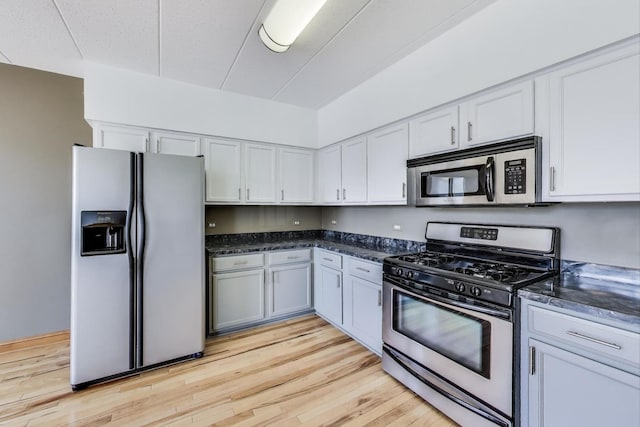 16671 Liberty Cir Unit 2N, Orland Park, IL 60467 - kitchen featuring appliances with stainless steel finishes, light wood-style flooring, and white cabinetry