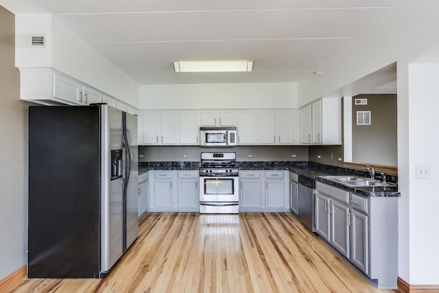 16671 Liberty Cir Unit 2N, Orland Park, IL 60467 - kitchen with stainless steel appliances, light wood finished floors, and white cabinetry