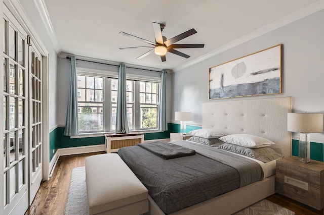 1038 Washington Blvd Unit 1, Oak Park, IL 60302 - bedroom featuring crown molding, wood finished floors, radiator heating unit, baseboards, and a ceiling fan