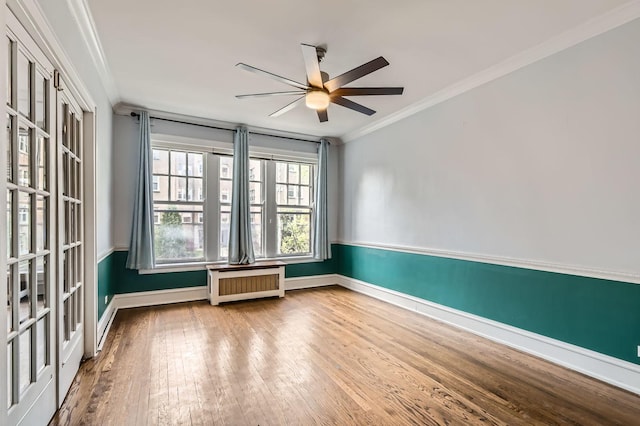 1038 Washington Blvd Unit 1, Oak Park, IL 60302 - spare room with radiator heating unit, hardwood / wood-style floors, crown molding, ceiling fan, and baseboards