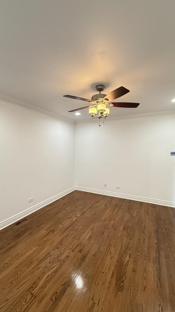 3004 S Canal St, Chicago, IL 60616 - spare room featuring ornamental molding, ceiling fan, baseboards, dark wood-type flooring, and recessed lighting