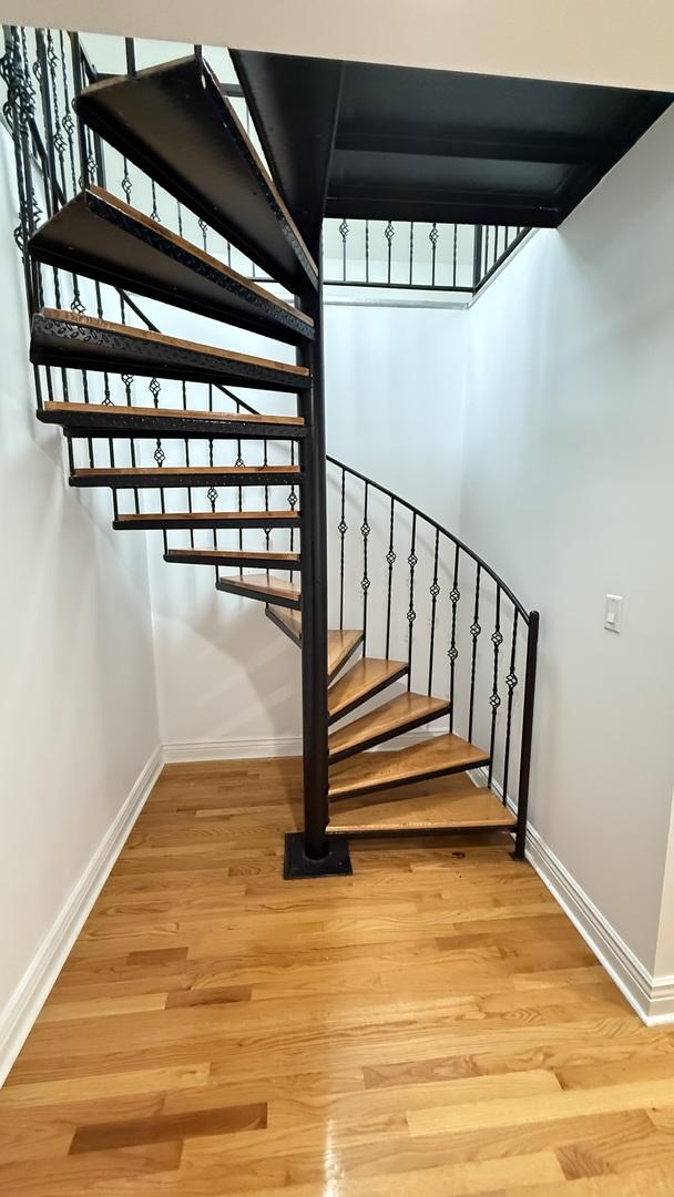 3004 S Canal St, Chicago, IL 60616 - staircase featuring baseboards and wood finished floors