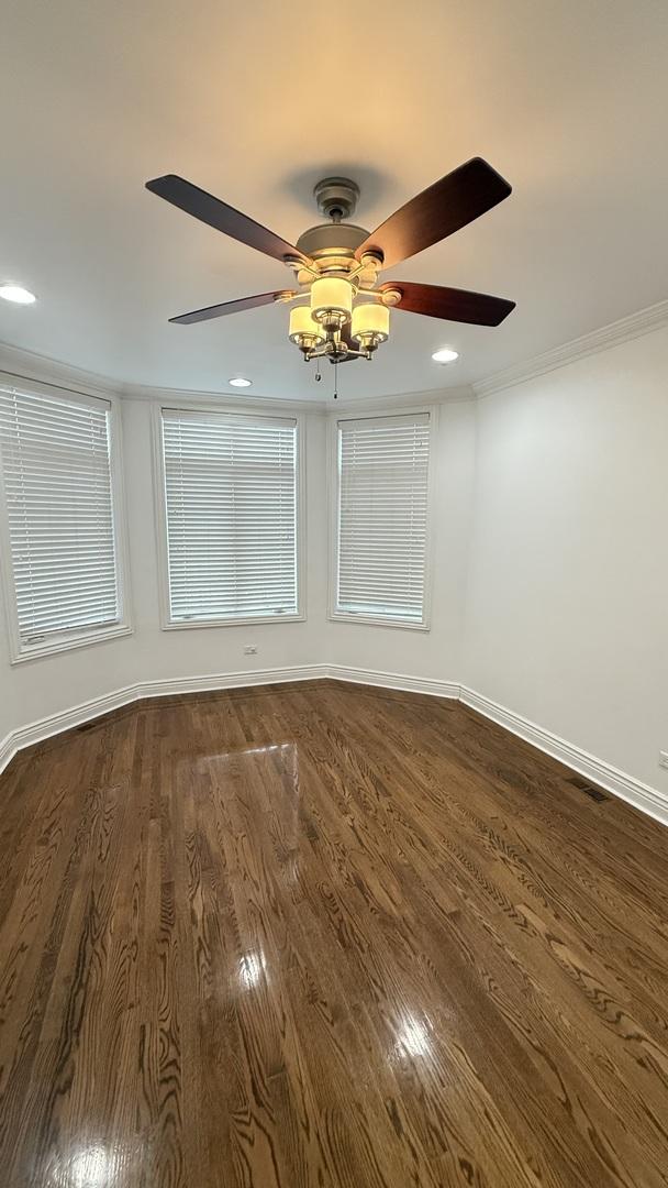 3004 S Canal St, Chicago, IL 60616 - unfurnished room featuring ceiling fan, dark wood-type flooring, baseboards, recessed lighting, and crown molding