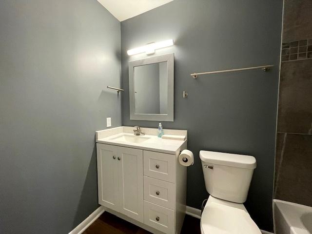 211 W Birchwood Dr Unit 211, Romeoville, IL 60446 - bathroom featuring toilet, vanity, and baseboards