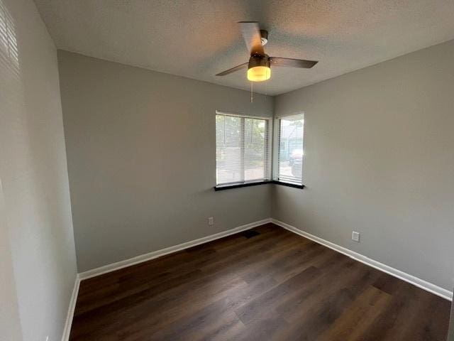 211 W Birchwood Dr Unit 211, Romeoville, IL 60446 - empty room with ceiling fan, dark wood-style flooring, and baseboards