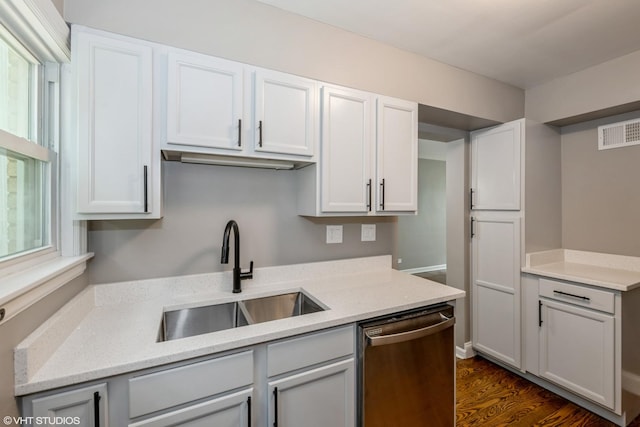 226 S Maple Ave Unit F, Oak Park, IL 60302 - kitchen with stainless steel dishwasher, light stone countertops, dark wood-type flooring, and white cabinetry