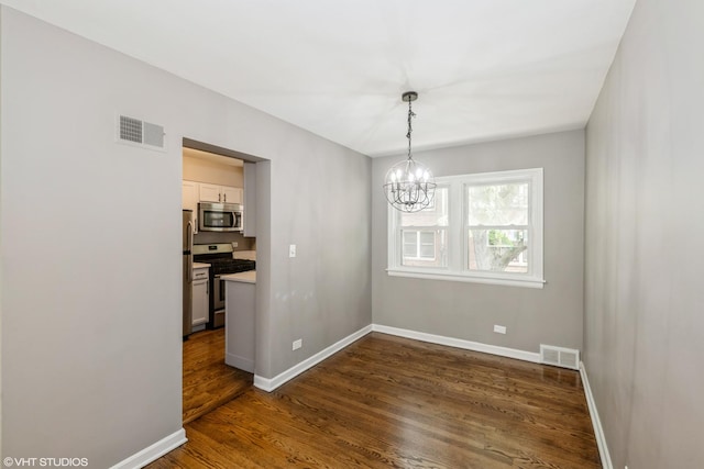 226 S Maple Ave Unit F, Oak Park, IL 60302 - unfurnished dining area with a chandelier and dark wood-type flooring