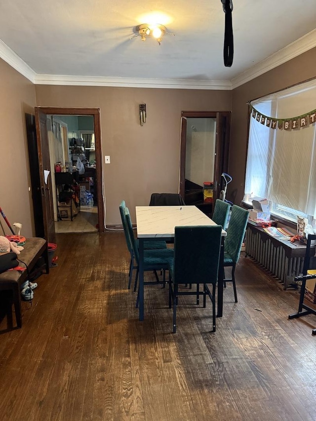 2145 N Karlov Ave, Chicago, IL 60639 - dining room featuring wood finished floors and ornamental molding