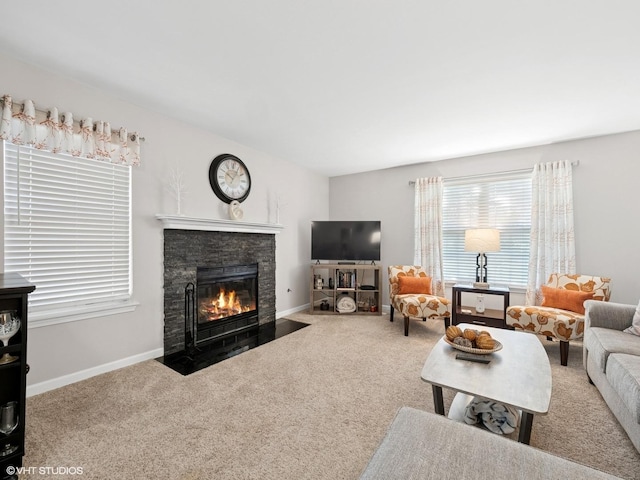 45 Tyler Ct Unit A, Streamwood, IL 60107 - carpeted living room with a stone fireplace and baseboards