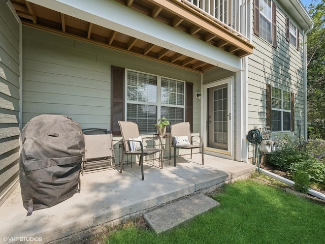 45 Tyler Ct Unit A, Streamwood, IL 60107 - covered porch with a balcony and a grill