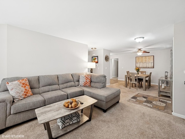 45 Tyler Ct Unit A, Streamwood, IL 60107 - living area featuring light colored carpet, baseboards, and ceiling fan