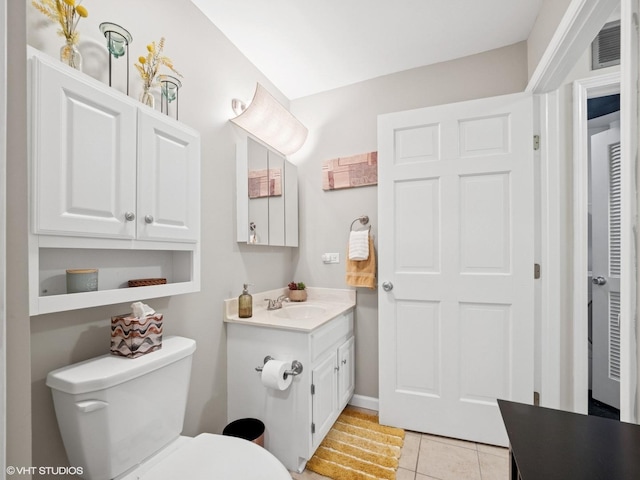 45 Tyler Ct Unit A, Streamwood, IL 60107 - bathroom with vanity, toilet, and tile patterned flooring
