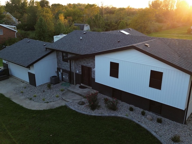 25232 S Harlem Ave, Monee, IL 60449 - rear view of house featuring roof with shingles, a yard, a view of trees, cooling unit, and stone siding