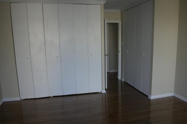 111 E Chestnut St Unit 15F, Chicago, IL 60611 - unfurnished bedroom featuring baseboards, wood finished floors, and ornamental molding