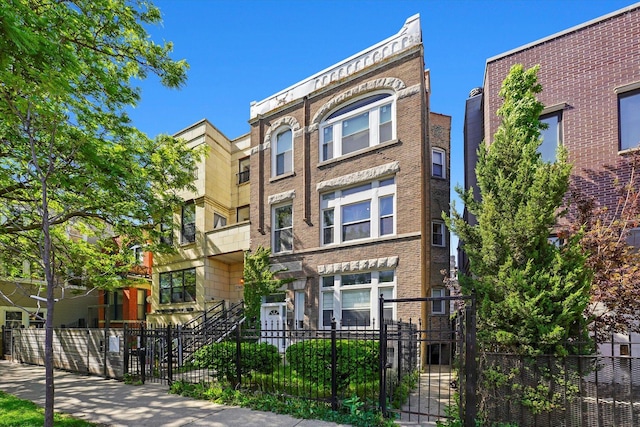 2744 W Haddon Ave Unit 2, Chicago, IL 60622 - view of front of home with brick siding and a fenced front yard