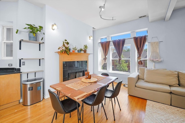 2744 W Haddon Ave Unit 2, Chicago, IL 60622 - dining area with a fireplace, light wood-type flooring, and track lighting