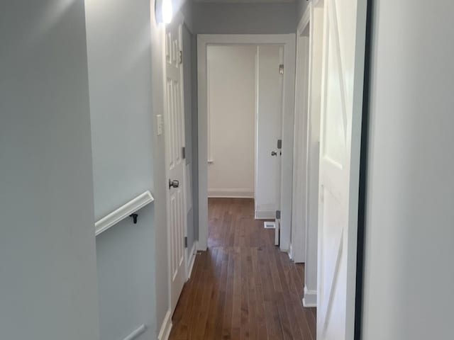 2627 E 74th Pl, Chicago, IL 60649 - hallway featuring dark wood-type flooring and baseboards