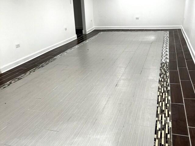 2627 E 74th Pl, Chicago, IL 60649 - spare room featuring baseboards