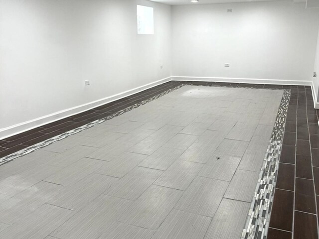 2627 E 74th Pl, Chicago, IL 60649 - below grade area with baseboards and wood finish floors