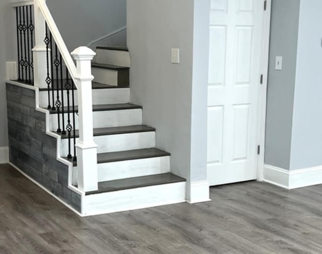 2627 E 74th Pl, Chicago, IL 60649 - staircase featuring baseboards and wood finished floors