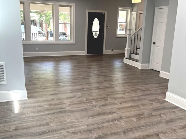 2627 E 74th Pl, Chicago, IL 60649 - entryway featuring baseboards, stairway, and wood finished floors