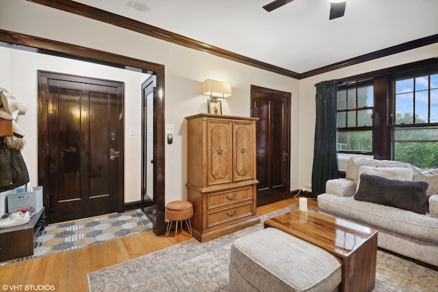 2017 W Farragut Ave Unit 1, Chicago, IL 60625 - living room featuring light wood-style flooring, ornamental molding, and ceiling fan