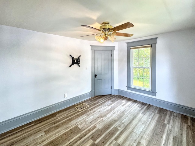 1204 W Reynolds St, Pontiac, IL 61764 - spare room with wood finished floors, ceiling fan, and baseboards