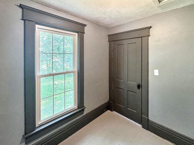 1204 W Reynolds St, Pontiac, IL 61764 - doorway featuring a textured ceiling and baseboards