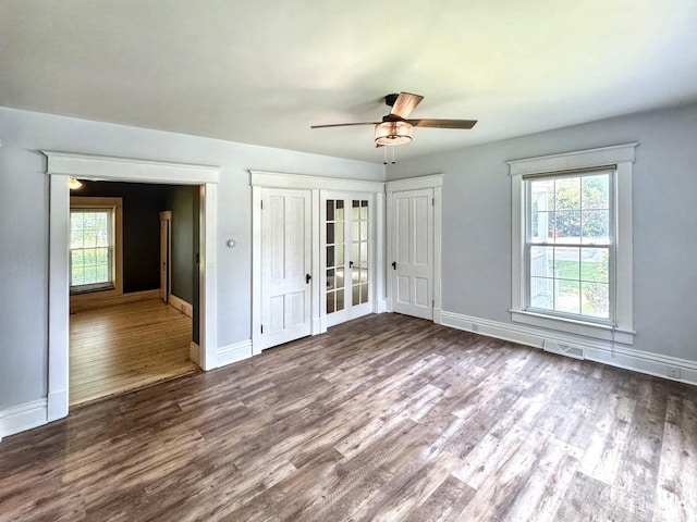 1204 W Reynolds St, Pontiac, IL 61764 - empty room featuring wood finished floors, a ceiling fan, and baseboards
