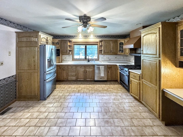 1204 W Reynolds St, Pontiac, IL 61764 - kitchen with wallpapered walls, stainless steel appliances, open shelves, wall chimney exhaust hood, and a sink