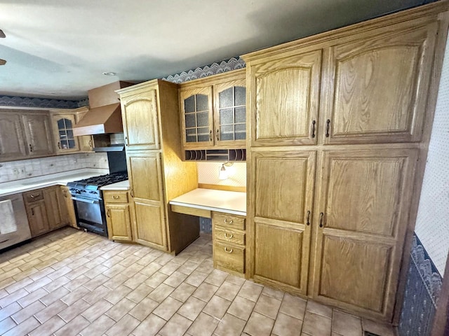 1204 W Reynolds St, Pontiac, IL 61764 - kitchen with black gas range oven, backsplash, light countertops, glass insert cabinets, and custom range hood
