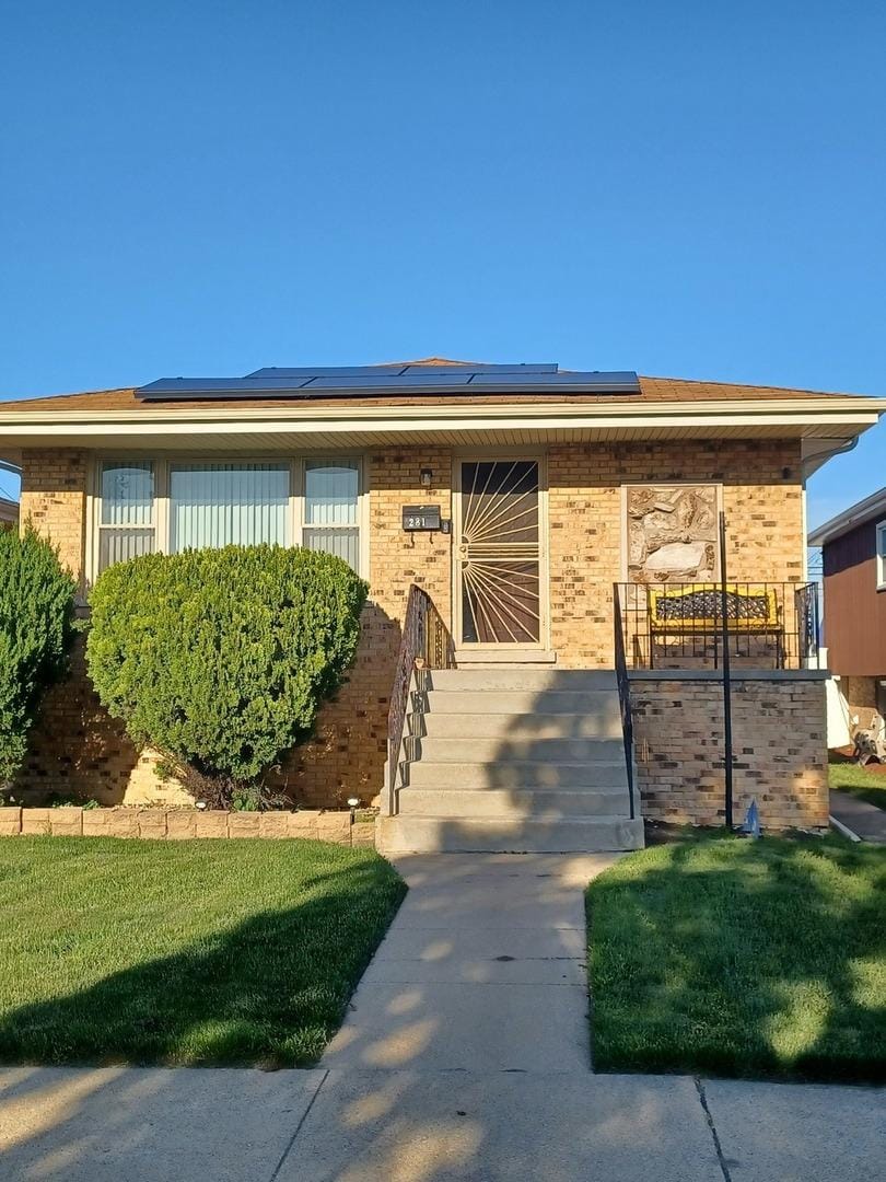 281 Hoxie Ave, Calumet City, IL 60409 - view of front facade with solar panels and brick siding