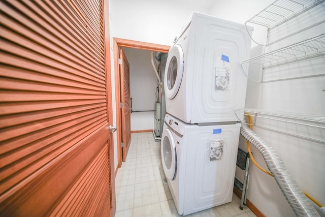 4770 N Manor Ave Unit 405, Chicago, IL 60625 - laundry room with stacked washer / drying machine and light flooring