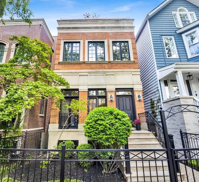 1332 W Wellington Ave, Chicago, IL 60657 - view of front of house with brick siding and a fenced front yard