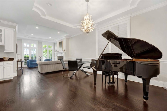 1332 W Wellington Ave, Chicago, IL 60657 - living area with a raised ceiling, dark wood-type flooring, a chandelier, crown molding, and recessed lighting