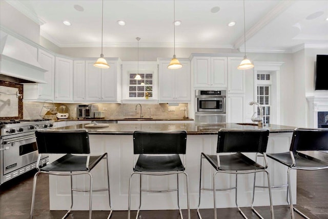 1332 W Wellington Ave, Chicago, IL 60657 - kitchen with designer range, a sink, white cabinets, a center island, and crown molding