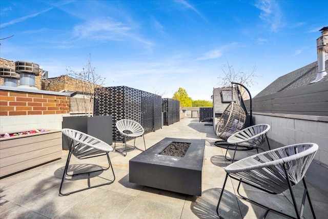 1332 W Wellington Ave, Chicago, IL 60657 - view of patio featuring an outdoor fire pit