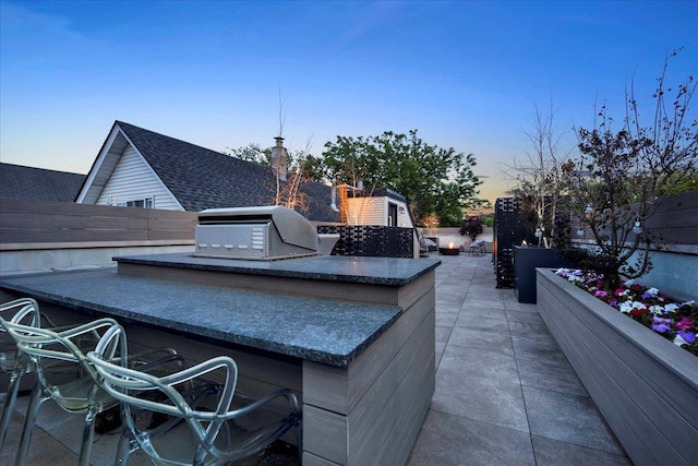 1332 W Wellington Ave, Chicago, IL 60657 - patio terrace at dusk featuring a patio area