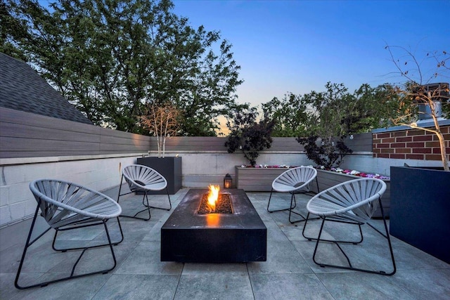 1332 W Wellington Ave, Chicago, IL 60657 - fenced backyard with a fire pit and a patio