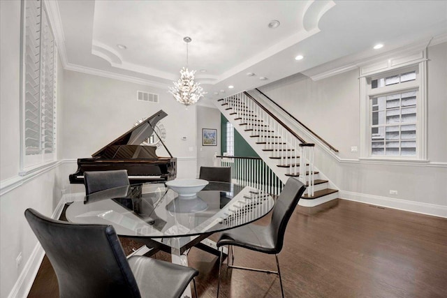 1332 W Wellington Ave, Chicago, IL 60657 - dining area with a chandelier, baseboards, stairs, wood finished floors, and a tray ceiling