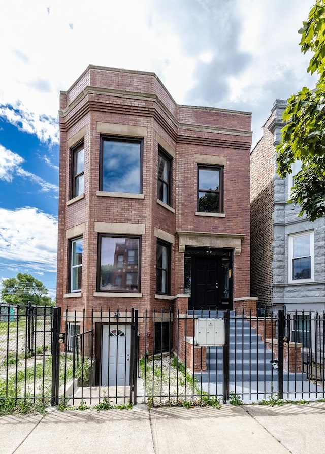 3651 W Grenshaw St, Chicago, IL 60624 - view of building exterior featuring a fenced front yard