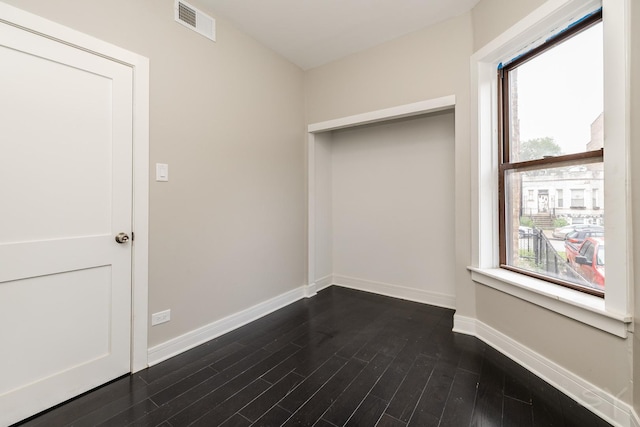 3651 W Grenshaw St, Chicago, IL 60624 - empty room with baseboards and dark wood-type flooring