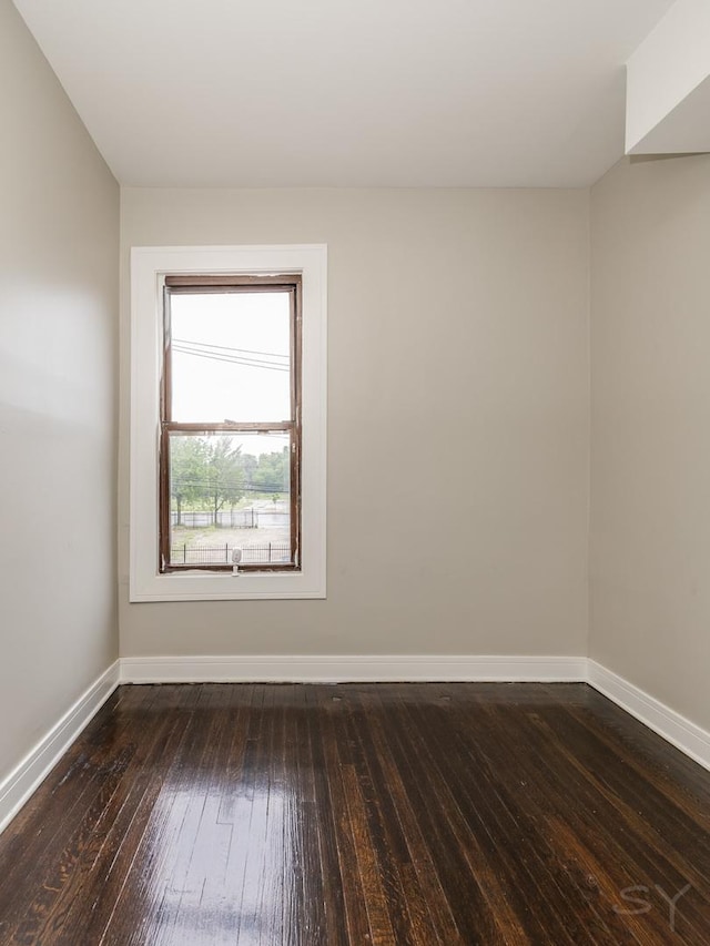 3651 W Grenshaw St, Chicago, IL 60624 - spare room featuring baseboards and hardwood / wood-style floors
