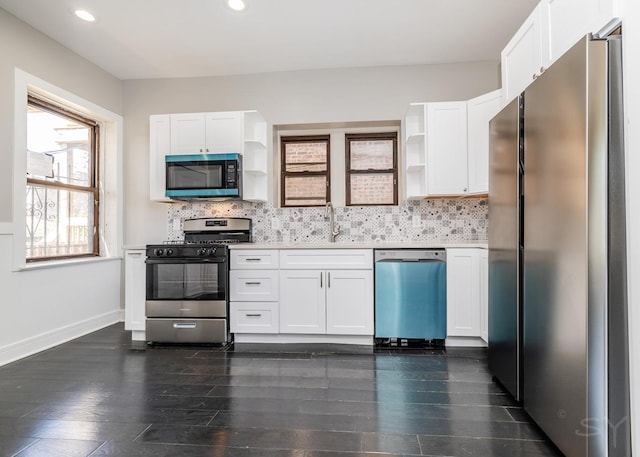 3651 W Grenshaw St, Chicago, IL 60624 - kitchen featuring stainless steel appliances, open shelves, white cabinetry, dark wood-style floors, and recessed lighting