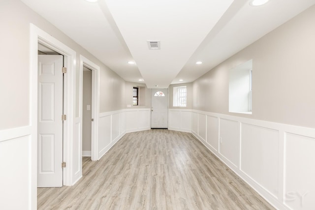 3651 W Grenshaw St, Chicago, IL 60624 - empty room featuring light wood-style flooring, a decorative wall, wainscoting, and recessed lighting