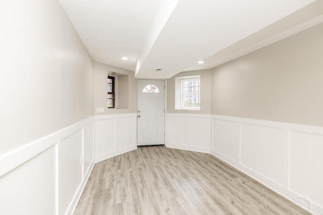 3651 W Grenshaw St, Chicago, IL 60624 - entryway with light wood finished floors, a decorative wall, a wainscoted wall, and recessed lighting