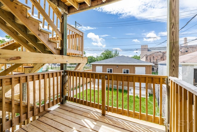 3651 W Grenshaw St, Chicago, IL 60624 - deck featuring stairs, an outbuilding, and a yard